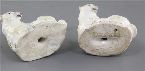 Two early Bow figures of young goats lying recumbent, c.1752-5, l. 5.5cm, ears and horns restored